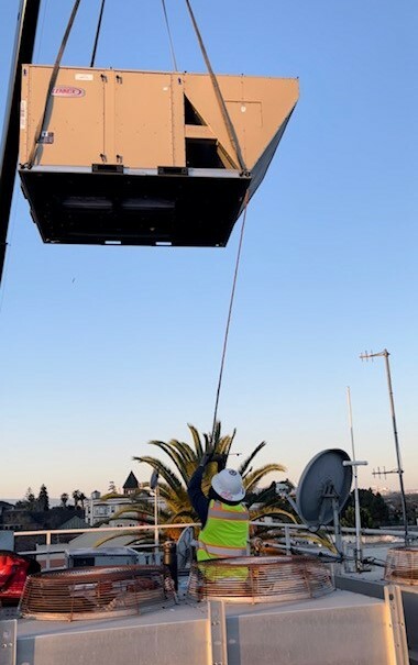 HVAC Unit on Crane being lowered onto EOC rooftop