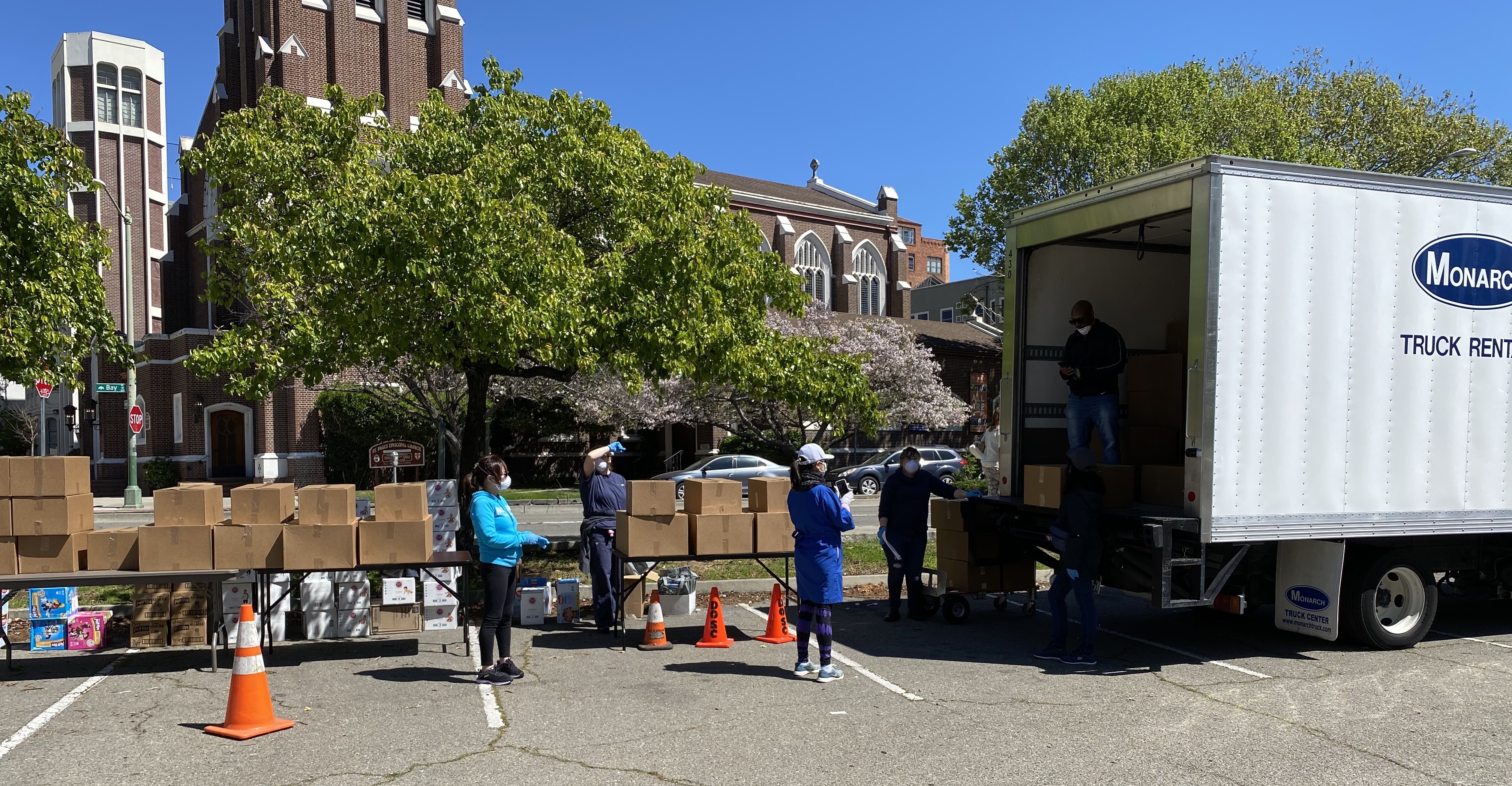 Head Start distributes food, diapers, and educational materials to families.