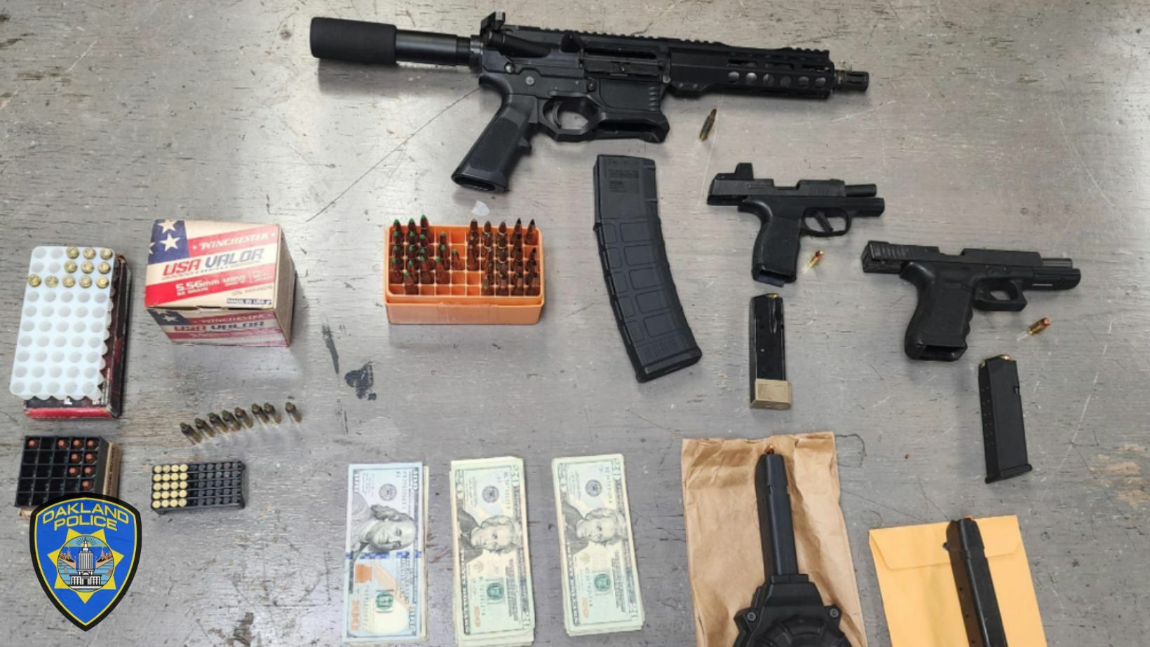 Photo of Firearms, ammunition and cash seized from an Illegal casino