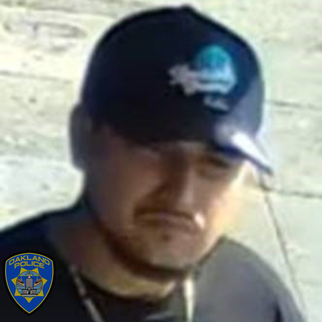 A wanted individual wanted in connection with a homicide. He is wearing a dark blue ball cap