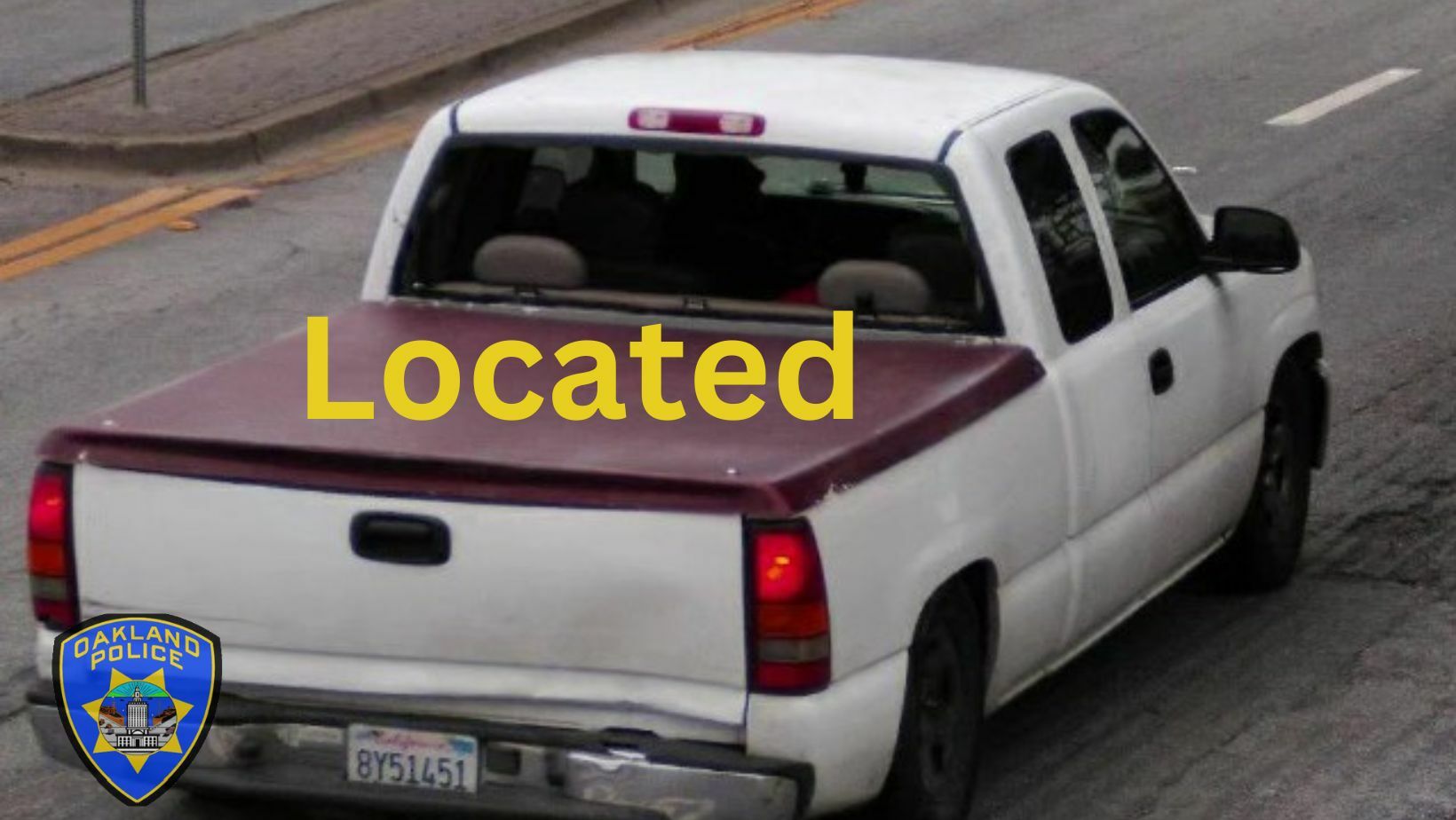 Photo of a white Chevy Pickup Truck, with a red cover on the bed.  California license plate 8Y51451 which has been located