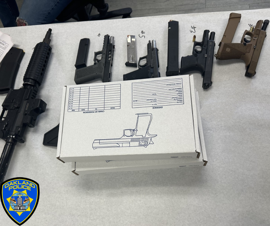 Photo of five recovered firearms and a box