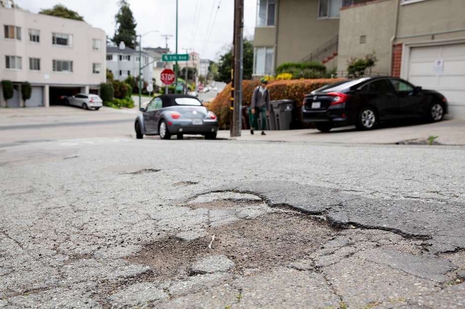 Closeup of a crack/pothole on Oakland streets