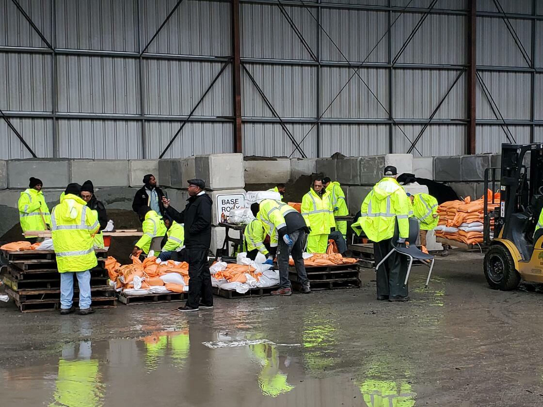 City crews and volunteers filling sandbags