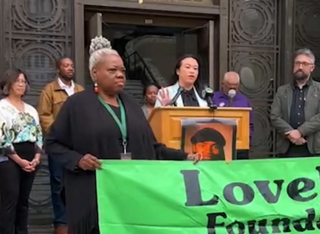 City leaders gather in front of Love Life banner