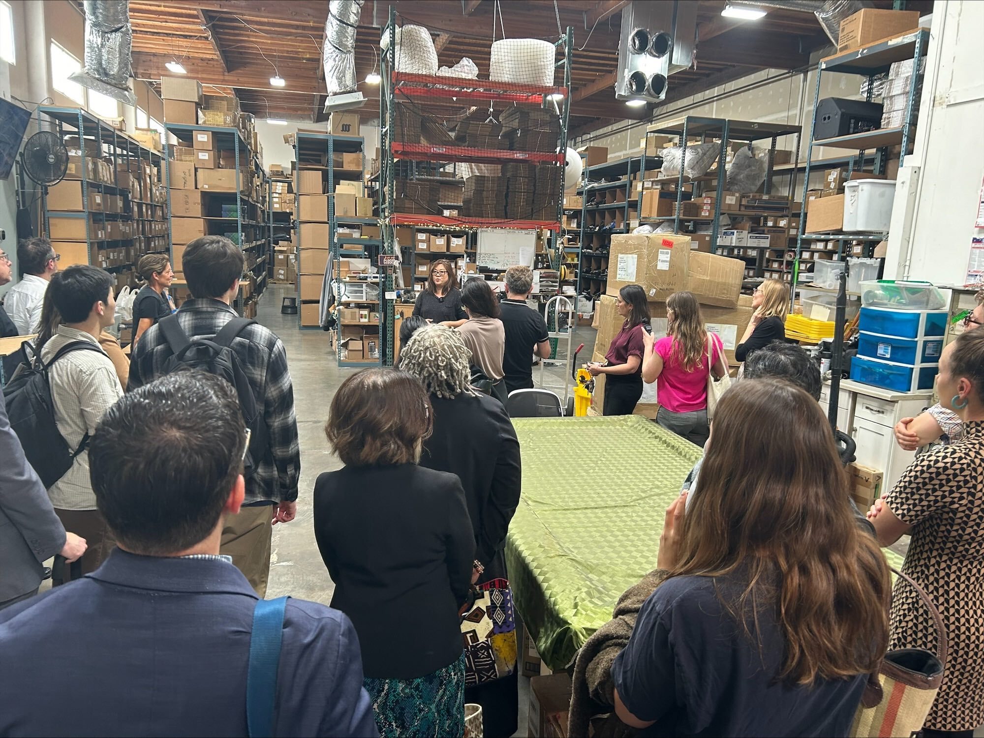 people in a warehouse on a tour